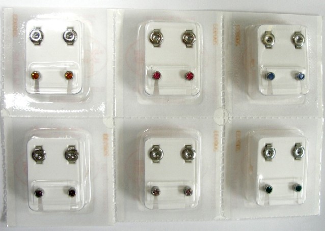ear piercing studs, white gold
on surgical steel with stones